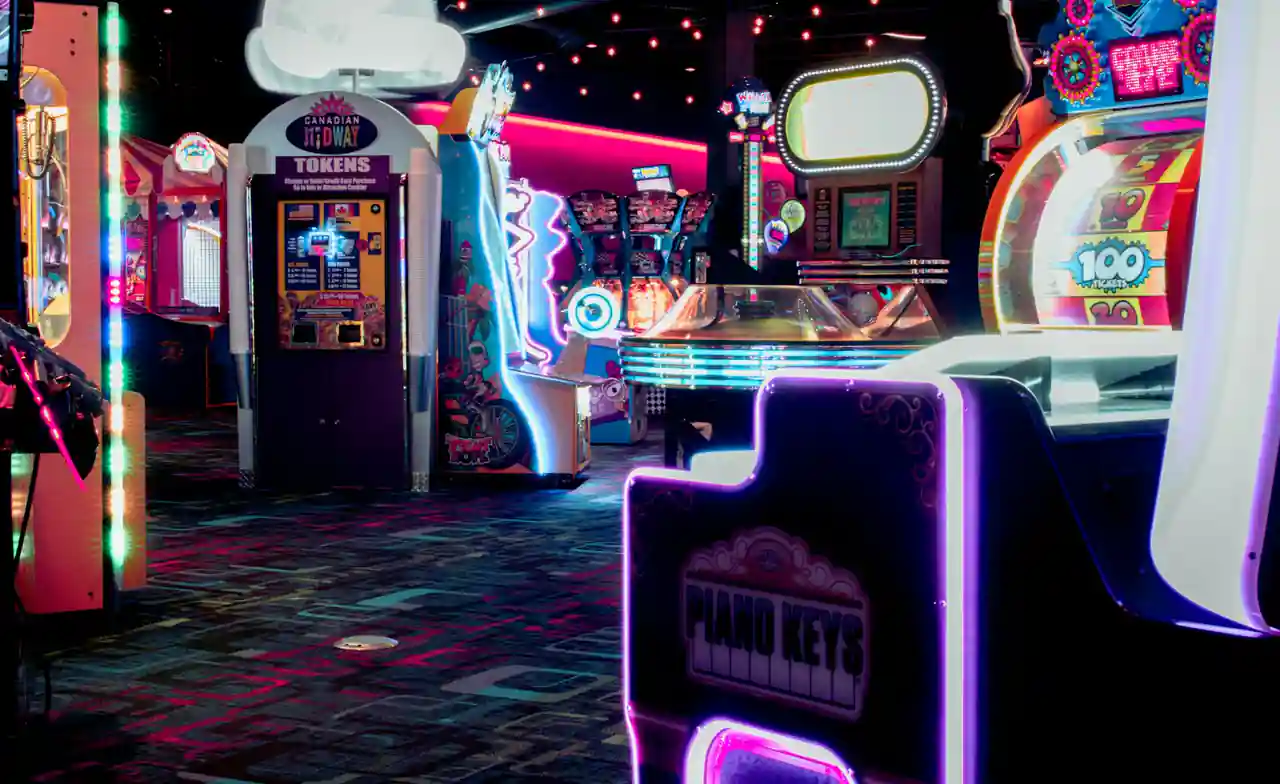 Colourful retro arcade interior glowing with neon and string lights